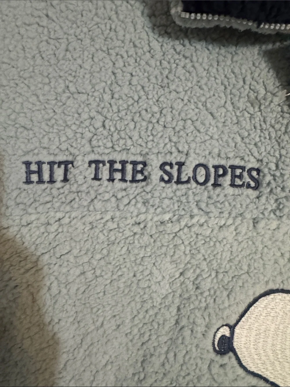 Peanuts Light Blue Sherpa Pullover with Navy Collar and Snoopy Ski Graphic